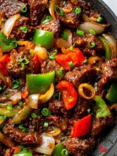 Chunks of goat meat stir-fried in pepper mix, a classic Nigerian party dish called Asun