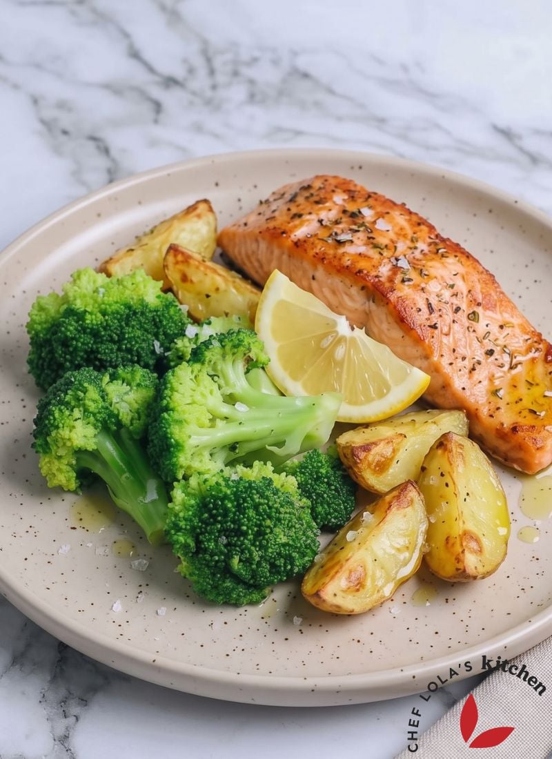 A plate of perfectly cooked microwave broccoli with vibrant green florets, served with fish and potatoes, ready to enjoy in minutes.