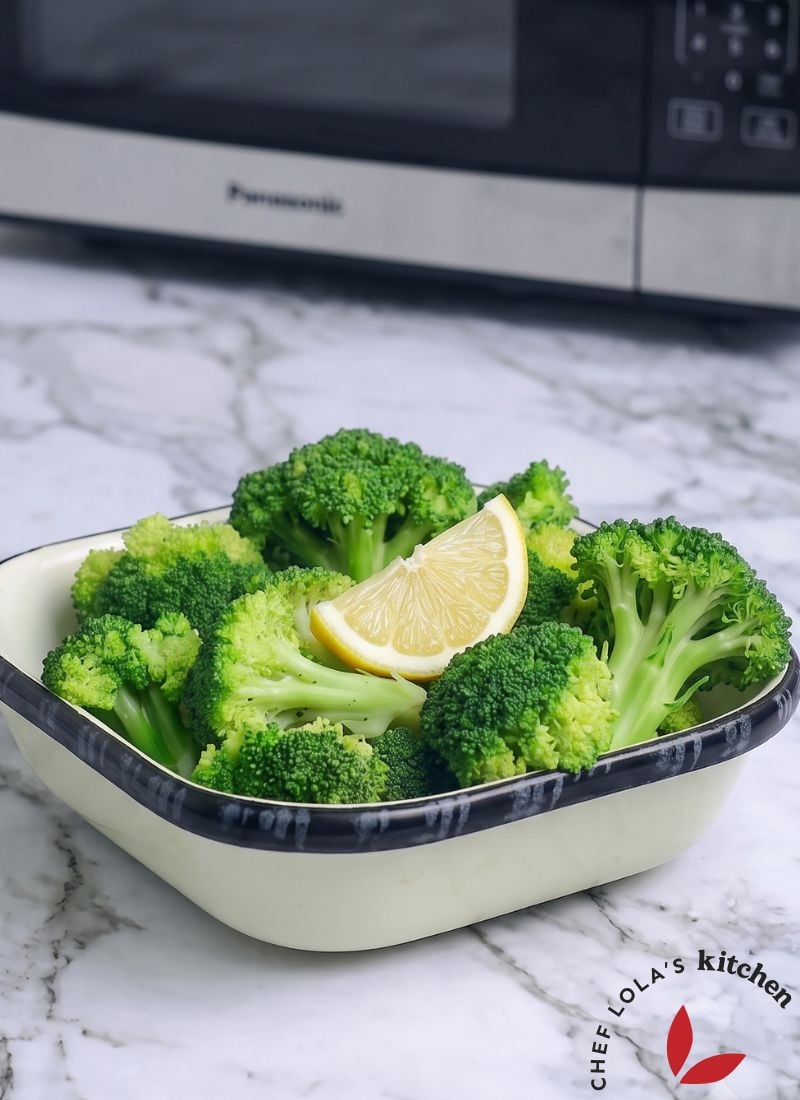 Fresh broccoli florets in a microwave-safe bowl, perfectly steamed in just minutes and ready to serve.