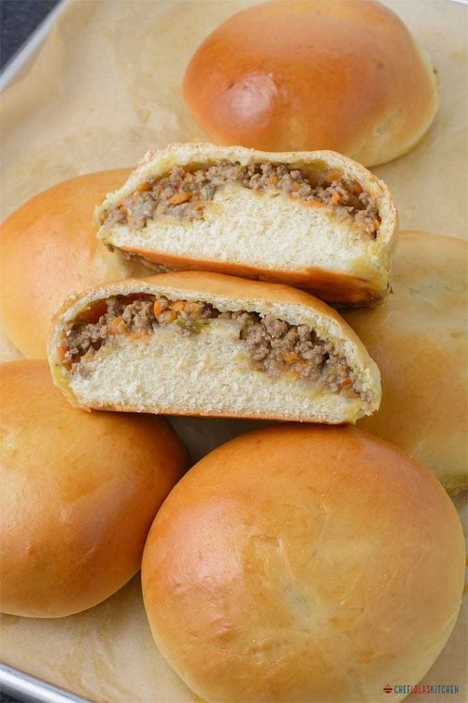 Freshly baked Meat Buns sliced into two to show the delicious meat filling