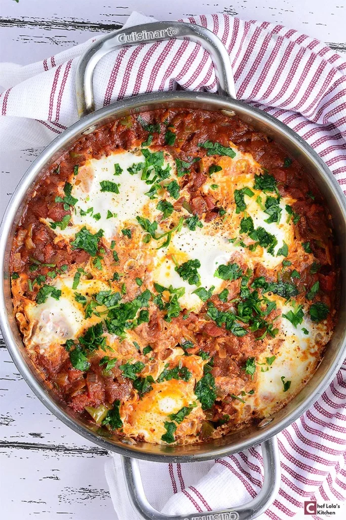 Healthy shakshuka made with eggs poached in a flavorful tomato and pepper sauce.