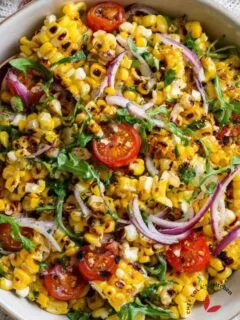 Sweet and smoky grilled corn salad with charred kernels and fresh diced vegetables.