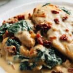 Delicious creamy Tuscan chicken garnished with parsley
