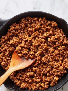 Close-up of perfectly browned ground beef in a pan showing uniform color and texture