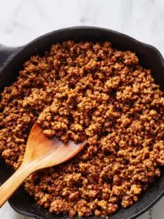Close-up of perfectly browned ground beef in a pan showing uniform color and texture