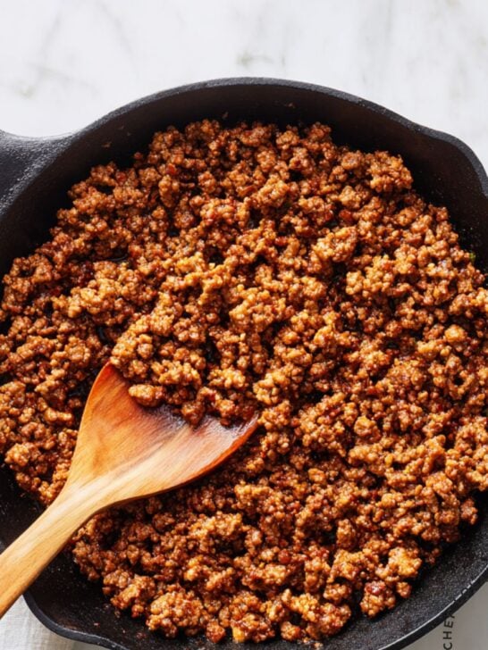 Close-up of perfectly browned ground beef in a pan showing uniform color and texture