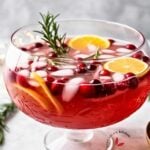 Holiday punch filled to the brim in a crystal punch bowl, brimming with Christmas cheer."