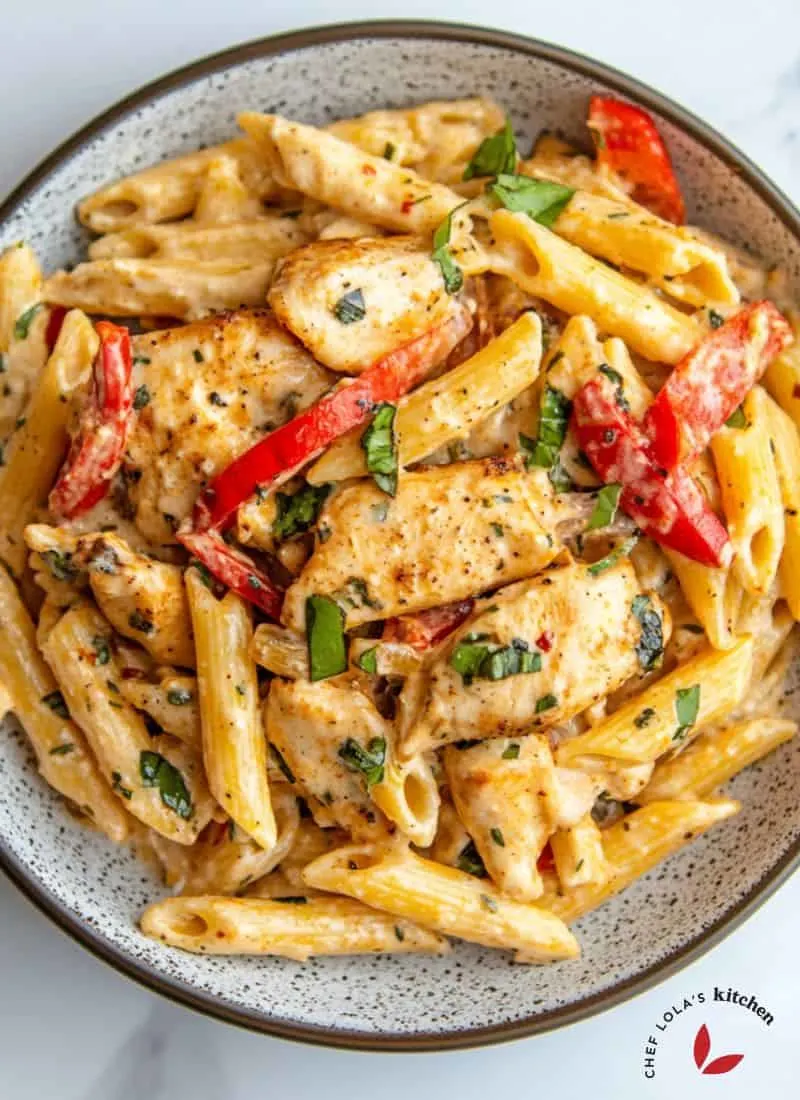 Delicious plate of creamy Jamaican jerk pasta, showcasing the rich, spicy sauce and tender pasta.