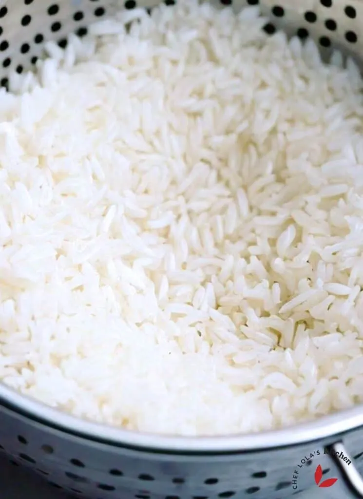 Parboiled rice in a colander showing it's well separated grains