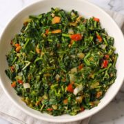 A bowl of flavorful Jamaican callaloo ready to serve with a variety of dishes.