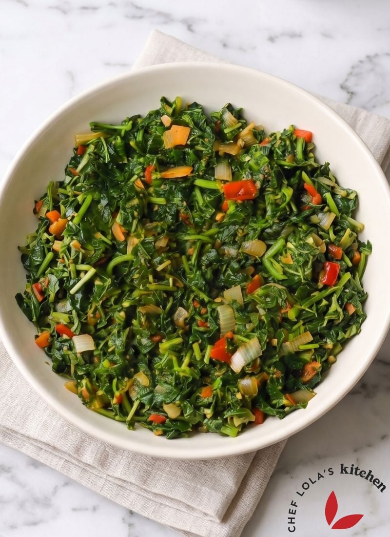 A bowl of flavorful Jamaican callaloo ready to serve with a variety of dishes.