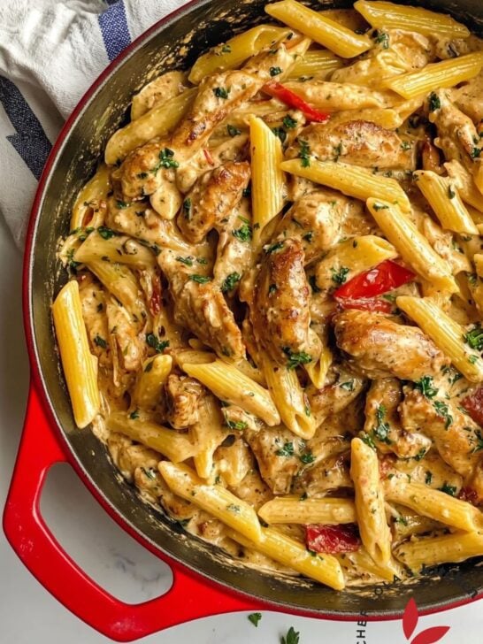 Delicious pot of creamy pasta with a rich Jamaican jerk sauce and grilled chicken slices.