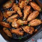 Air fried chicken wings garnished with parsley