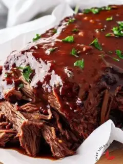 Beef brisket made in the slow cooker and brushed with bbq sauce