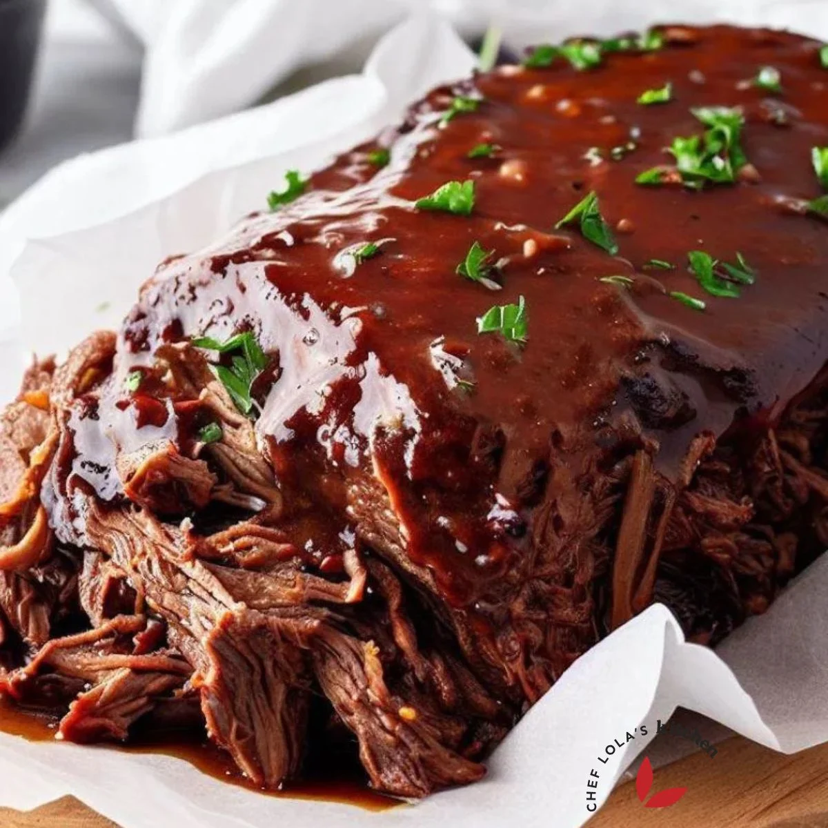 Beef brisket made in the slow cooker and brushed with bbq sauce