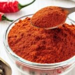 Homemade Berbere Spice scooped up with a spoon to show it's beautiful texture