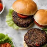 Delicious black bean burger with lettuce, tomato, and a whole-grain bun.