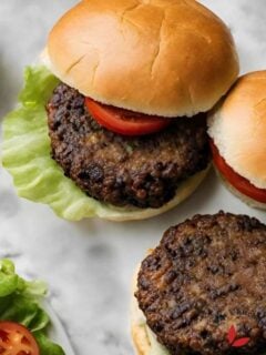 Delicious black bean burger with lettuce, tomato, and a whole-grain bun.