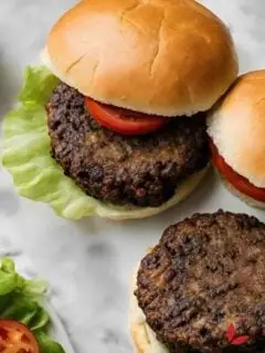 Delicious black bean burger with lettuce, tomato, and a whole-grain bun.