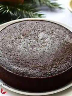 Freshly baked Jamaican Black Rum Cake, displaying its characteristic dark, glossy surface.
