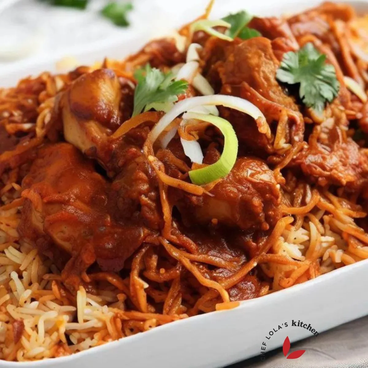 Swahili Chicken Biryani served in a tray garnished with cilantro and onions