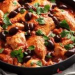 Delicious Chicken cacciatore in a skillet garnished with parsley
