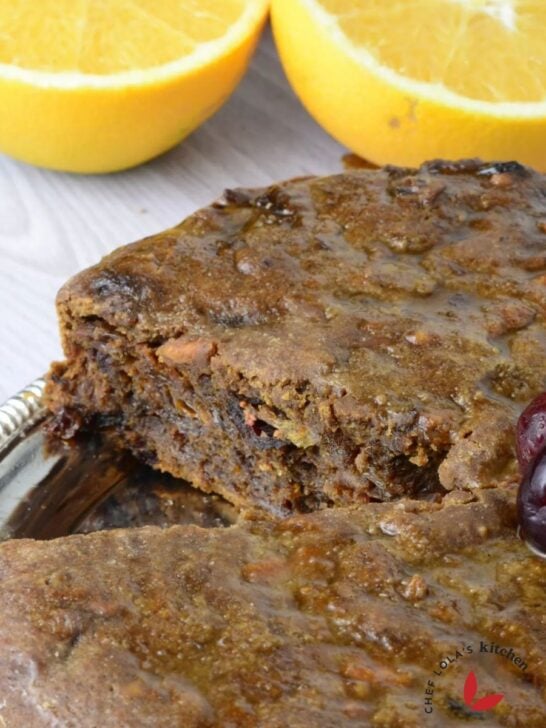 Freshly baked Christmas fruit cake decorated with bright red cherries