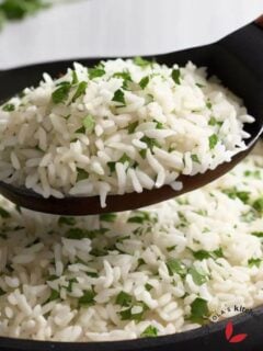 Fluffy Cilantro lime rice scooped with a spoon to show it's texture