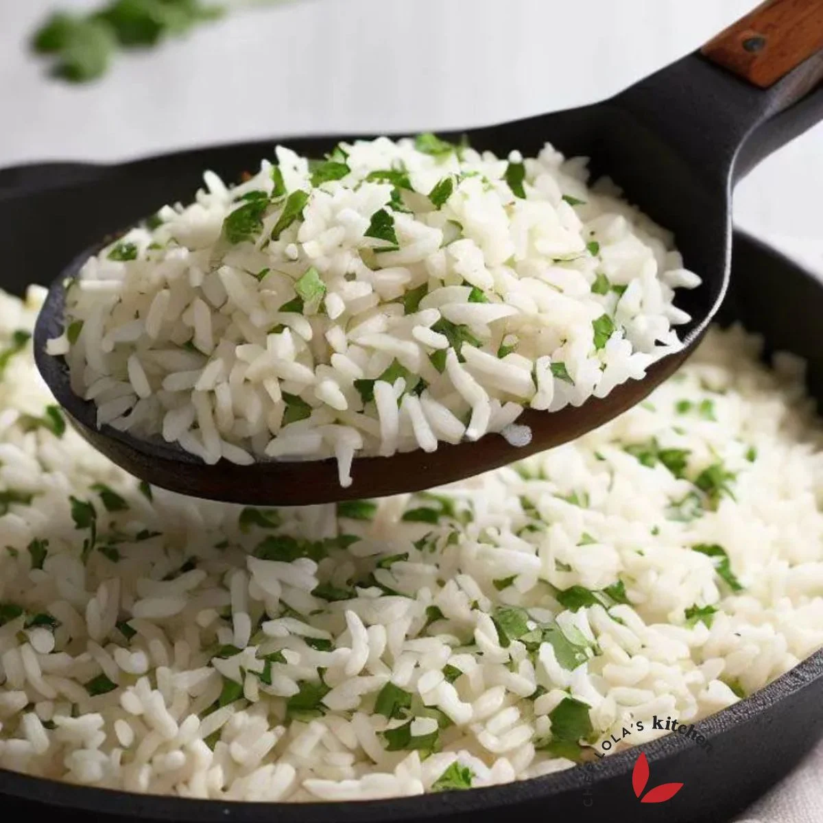 Fluffy Cilantro lime rice scooped with a spoon to show it's texture