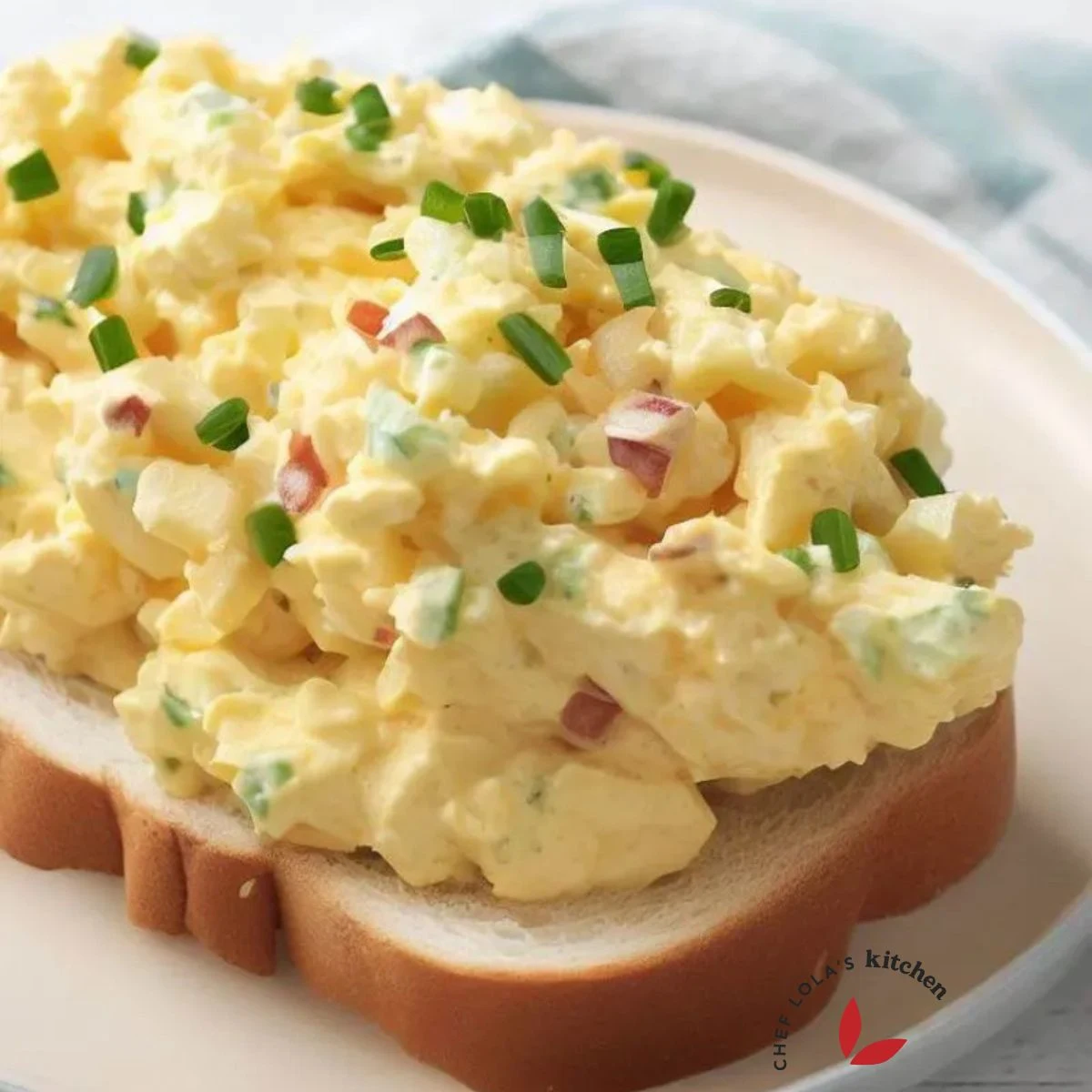 Delicious egg salad served over a slice of bread