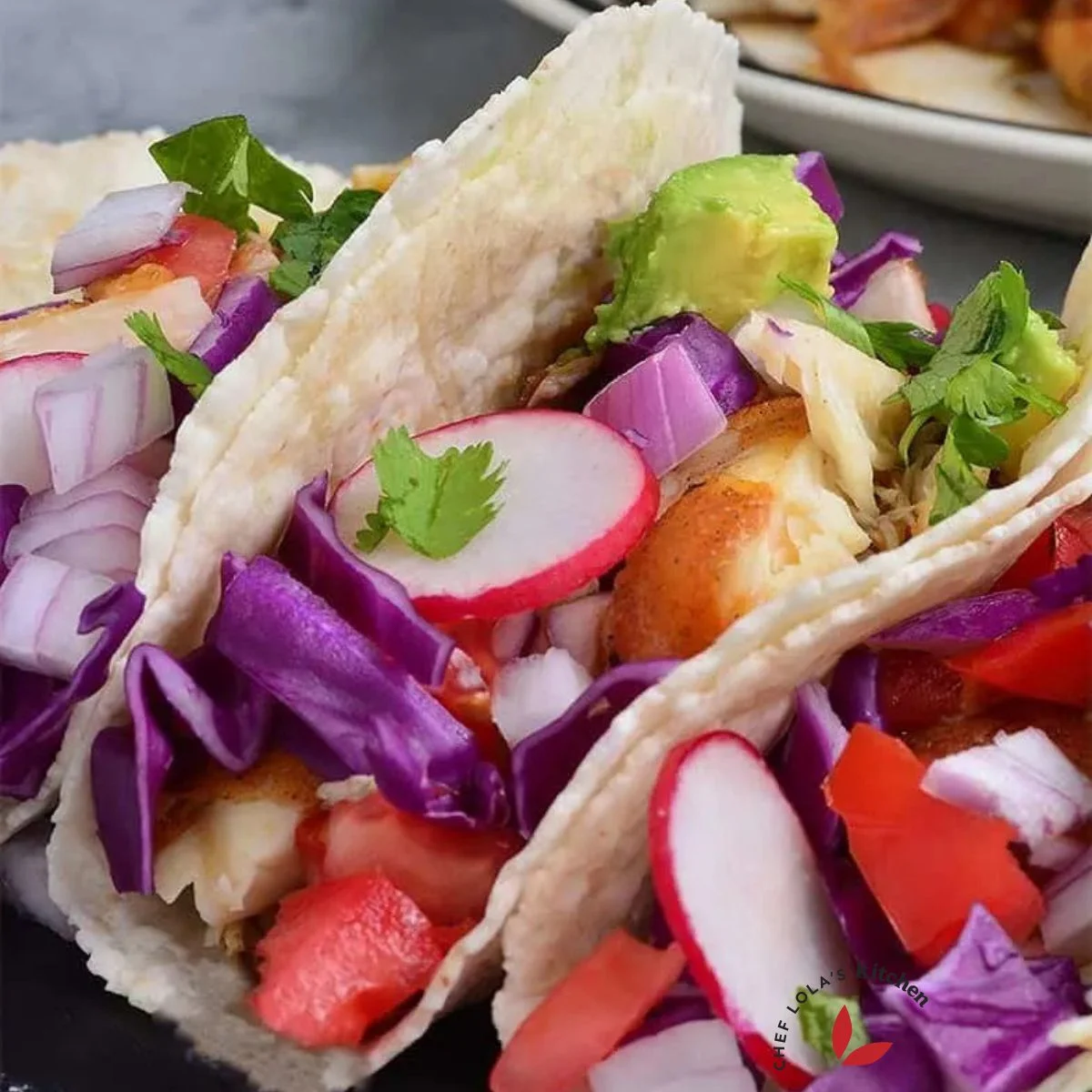 Fish tacos with guacamole and fresh veggies