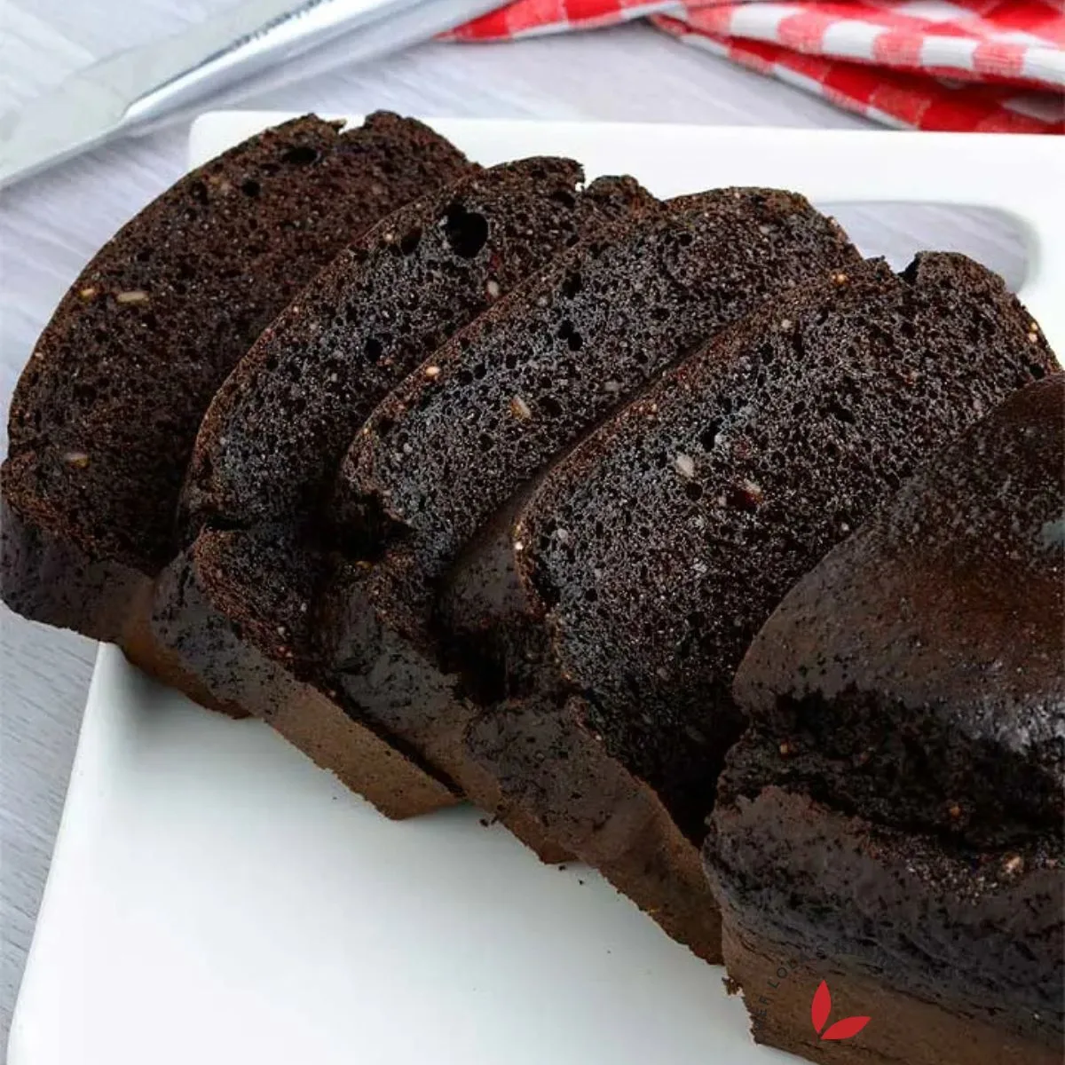 Sliced flourless chocolate cake on a plate