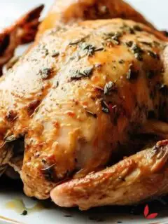Oven Roasted Garlic Herb Butter Chicken served on a plate