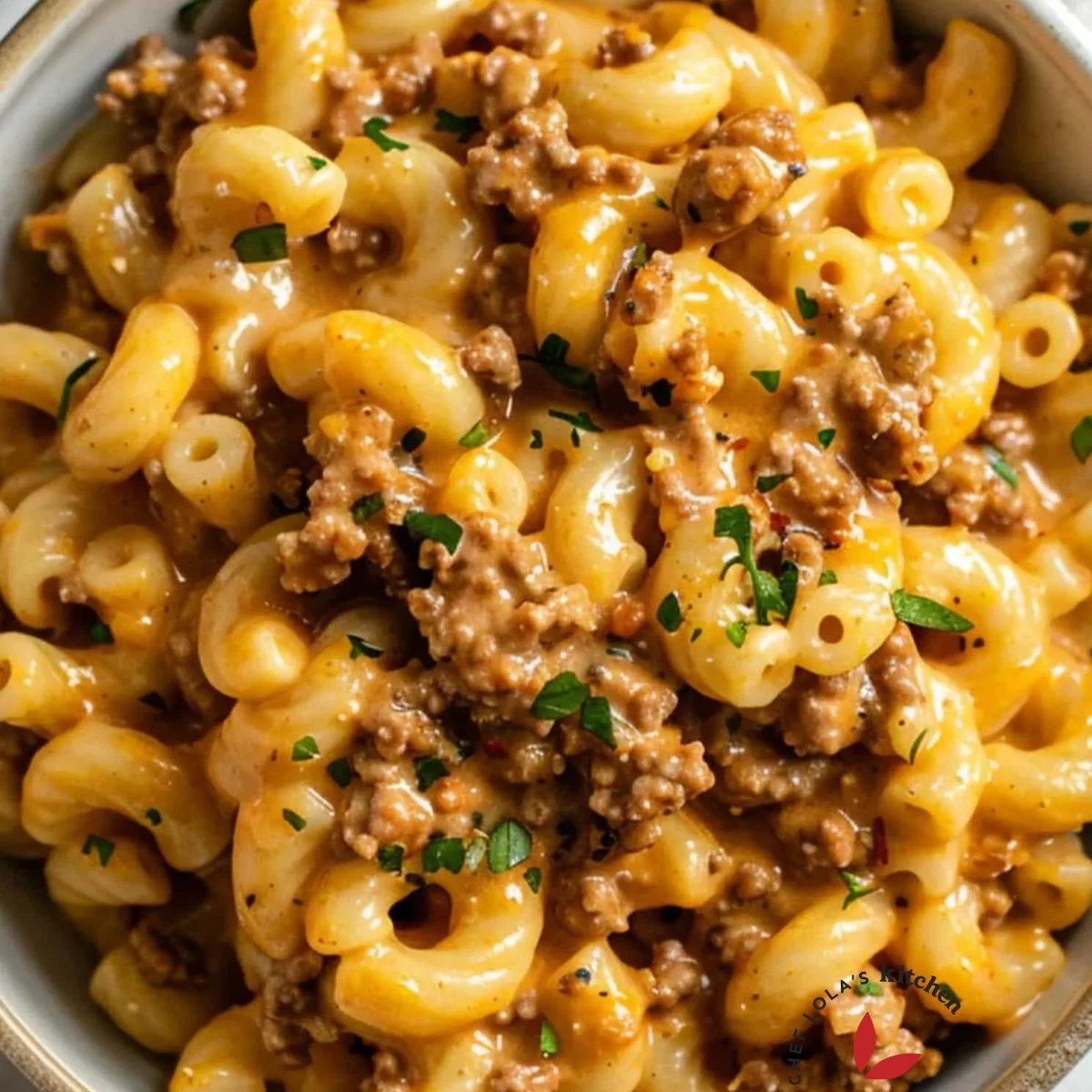 A delicious pasta dish with ground beef and melted cheddar cheese.