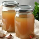 Homemade broth stored in a jar