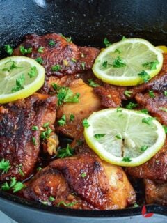 Delicious Honey garlic Chicken. garnished with lemon slices and parsley
