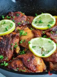 Delicious Honey garlic Chicken. garnished with lemon slices and parsley