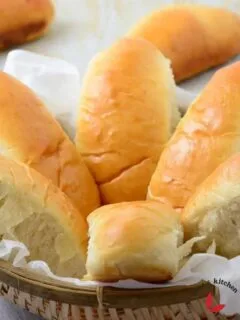 Hot dog buns in a small basket