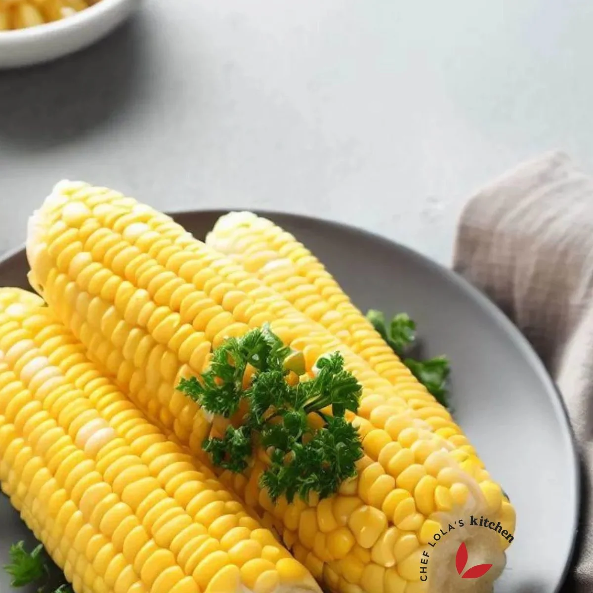 Boiled corn on the cob with a slice of butter
