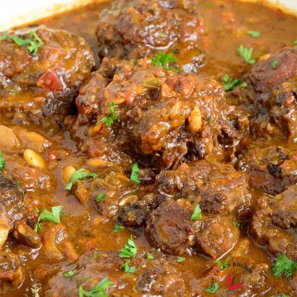 Jamaican oxtail stew garnished with parsley