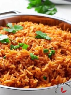 Mexican rice in a skillet garnished with cilantro