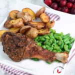 Oven Roasted Turkey Legs served with potatoes and green beans