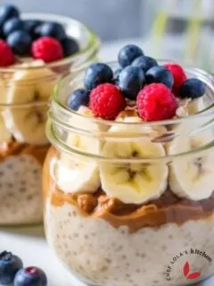 Overnight Oatmeal in a Jar: A jar filled with creamy oats, topped with fresh berries and banana slices