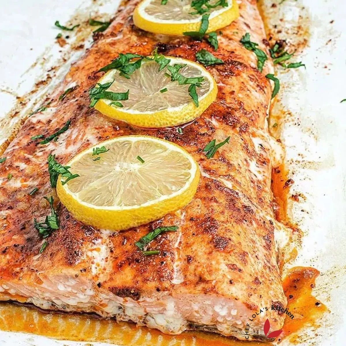 Oven baked Salmon fish garnished with lemon slices