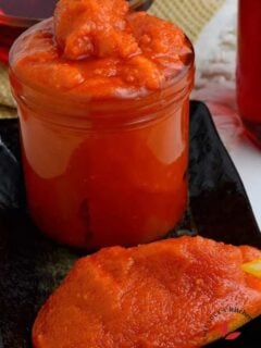 Palm oil at room temperature in a wooden spoon