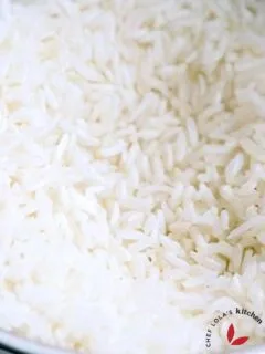 Parboiled rice in a colander showing it's well separated grains