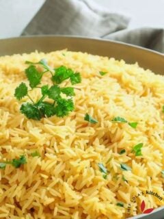 Delicious Saffron rice in a skillet beautifully garnished with parsley