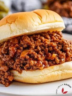 Close-up view of a homemade Sloppy Joe sandwich on a toasted bun.
