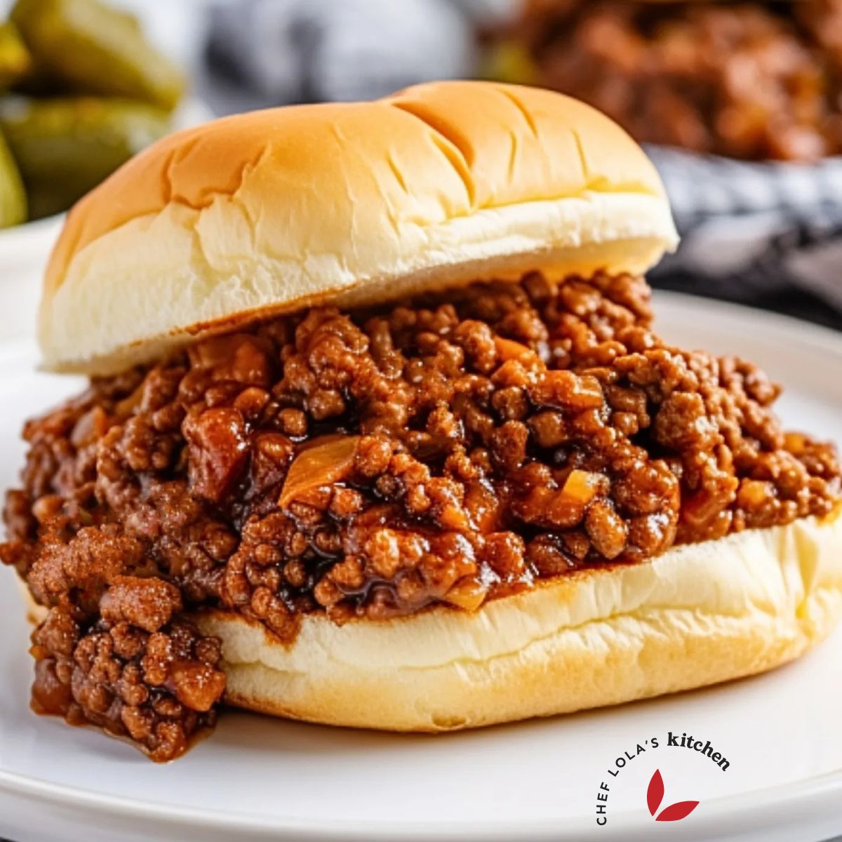 Close-up view of a homemade Sloppy Joe sandwich on a toasted bun.