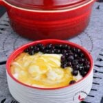 creamy grits served with honey and blue berries